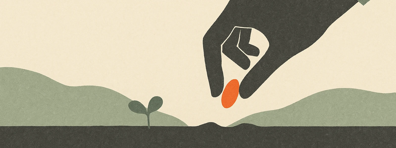 A hand planting a small orange seed